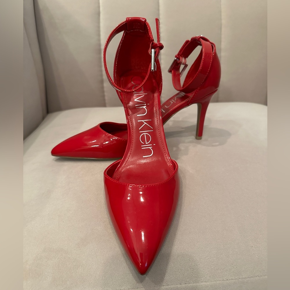 Brand new without tags Calvin Klein red heels. Very cute and comfortable.